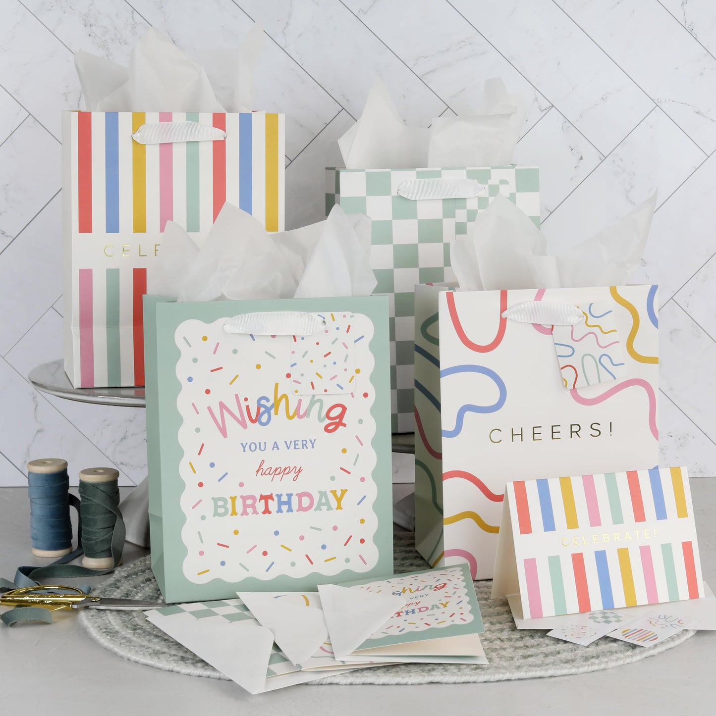 Beautiful Gift Bags Set of 4 - Medium Sized 9" Bags with Handles incl. Matching Tissue Paper, Cards & Small Stickers - Reusable & For Presents of Any Birthday, Weddings, Mothers Day & Other Occasion